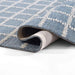 Momeni Archer Indoor Rug - ARC-3 Blue is slightly folded to display its flexible, soft texture and high-quality craftsmanship