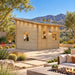 Multi Cube Versa 100 Freedom Office configured as a compact home office in a sunny Nevada backyard, with two adults working inside amid desert landscaping and mountain views.
