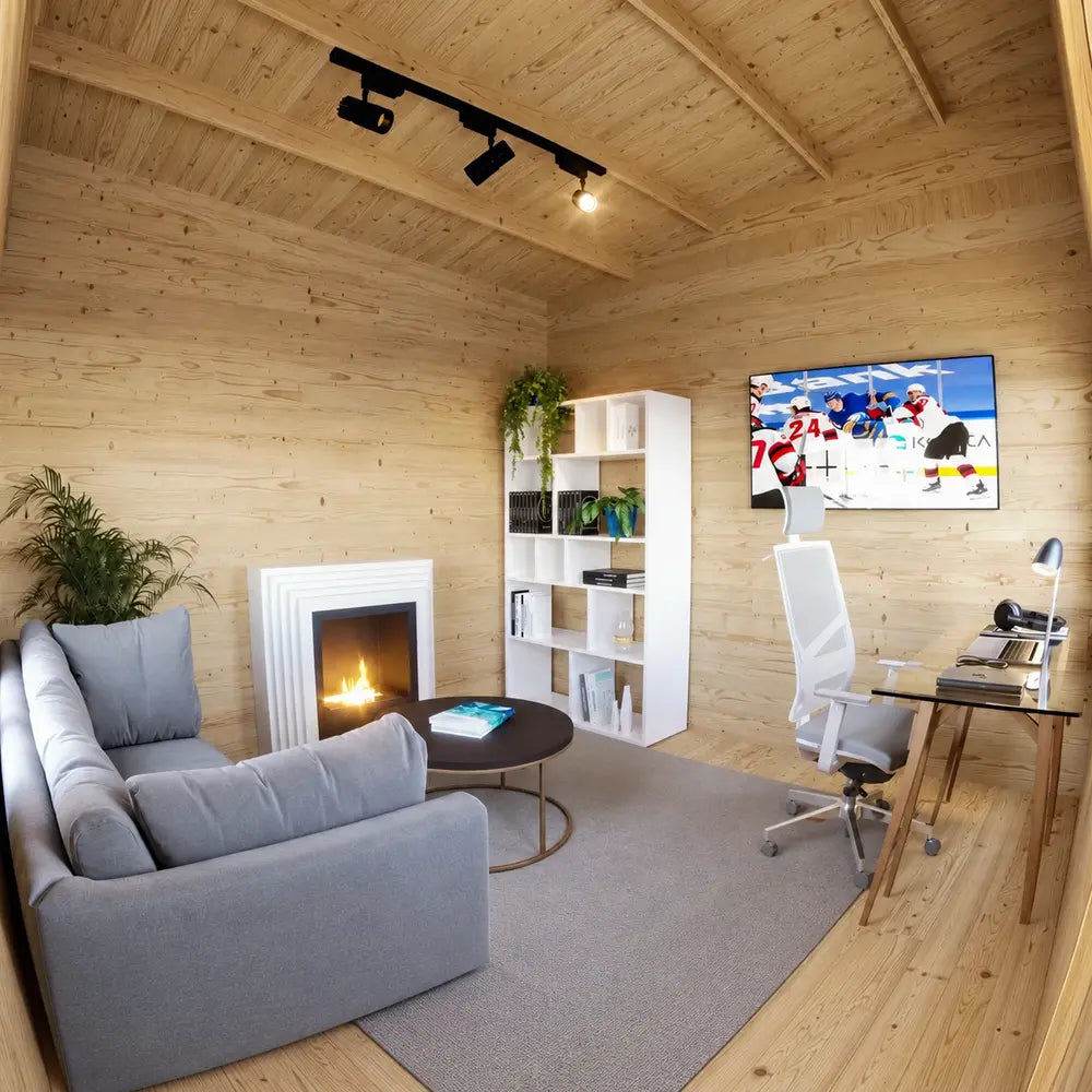 Warm pine interior of the Multi Cube Versa 100 with a gray sofa, modern fireplace, round coffee table, shelving, television, and compact workspace.