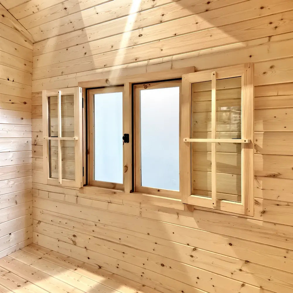  Multi Cube Versa 100 window unit with two outward-opening wooden shutters surrounding central glazed panels on a sunlit pine wall.