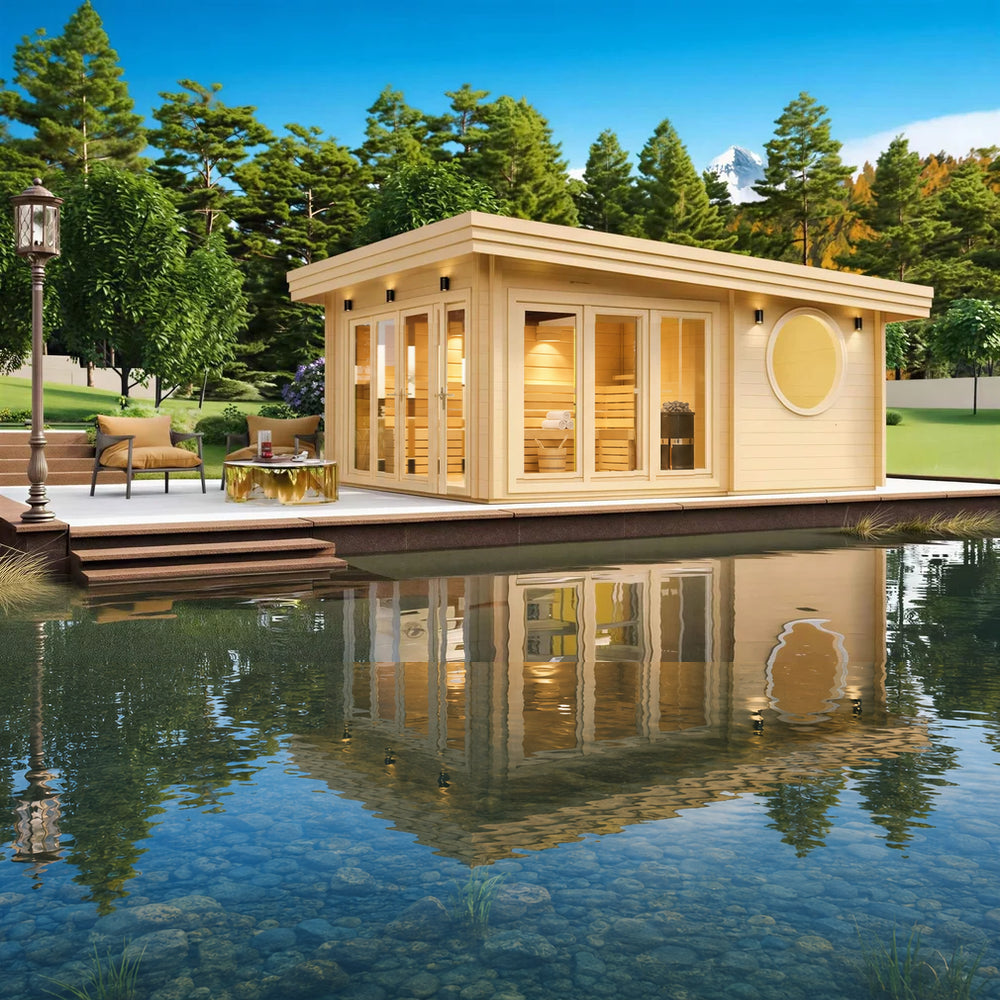 Nestled beside a pond with mountain views, the GardenHouse24 USA Sauna Tanonka 70 Garden Room glows warmly from within its stylish, circular-windowed frame