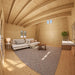 Northwood Grand DD interior with a white sofa, large geometric rug, round coffee table, kitchenette and wooden ladder leading to the loft.