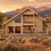 Olivia 90 Cabin Kit transformed into an upscale golden-hour entertainment bar, with adults socializing in a Wyoming ranch landscape near Cody.
