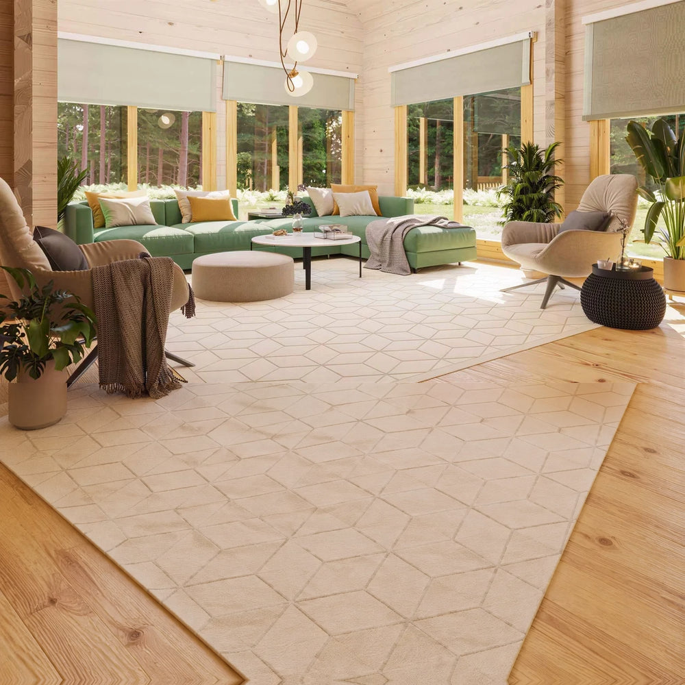 A cozy, sunlit living room with green and beige furnishings surrounded by large forest-view windows inside the GardenHouse24 USA Olivia 90 Garden Room