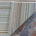One corner of the Couristan Cape Indoor/Outdoor Rug - Shoreham/Ivory-Multi is flipped to reveal the backside’s neat finish and consistent pattern