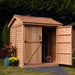 One door of the Outdoor Living Today Maximizer 6×6 Wooden Shed is open, revealing gardening equipment stored neatly inside
