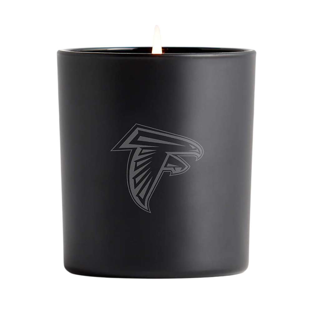 Onyx black single-wick Crate & Barrel Monochrome Scented Candle featuring a subtle Atlanta Falcons logo on the front