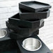 Onyx Game Theory Tables Tiered Tray showcases a neat stack of sleek black trays on a tabletop