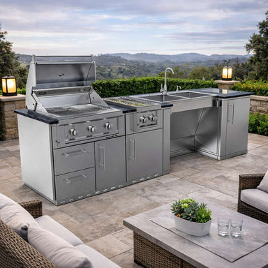 Open grill view of the Sunstone Summit 10ft Outdoor Kitchen Island Package showing cooking grates, sink, and cabinets in an outdoor setting