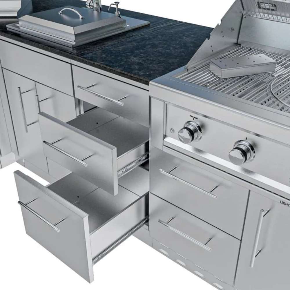Open stainless steel drawers and grill controls showing storage space in the Sunstone Texas Tango 19ft Outdoor Kitchen Island Package