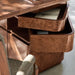 Open swivel drawers on Crate & Barrel Greye 60" Burl Wood Desk with Swivel Drawers reveal convenient built-in storage compartments