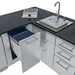 Open trash cabinet and sink area with drawers in the Sunstone Texas Tango 19ft Outdoor Kitchen Island Package