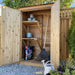 Outdoor Living Today 6ft Western Red Cedar Shed Shelves (Set of 3) are inside a small outdoor cabinet, storing gardening items like pots, soil, and tools with the doors open
