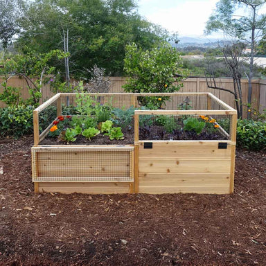 Outdoor Living Today 6×3 Raised Garden Bed filled with vegetables, with one mesh lid section lowered for access