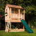 Outdoor Living Today 6x6 Little Cedar Playhouse & Sandbox features a compact wooden playhouse with a green slide and built-in sandbox on grass