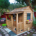 Outdoor Living Today 6x6 Little Cedar Playhouse & Sandbox features a cozy cedar playhouse with a front porch, flower box, and garden surroundings