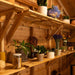 Outdoor Living Today 8ft Western Red Cedar Shed Shelves (Set of 3) are filled with potted plants and jars