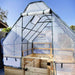 Outdoor Living Today 8×8 Raised Garden Bed is enclosed by a clear plastic greenhouse cover supported by a black frame
