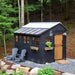 Outdoor Living Today Western Red Cedar Shed Ramp is used with a black shed in a landscaped yard