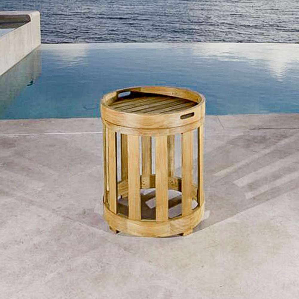 Outdoor Westminster Teak Kafelonia Side Table on a patio beside a pool and ocean view
