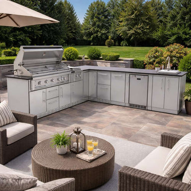Outdoor lounge setup with Sunstone Rancher L-Shaped 8′11″ × 11′ Outdoor Kitchen Package and seating area