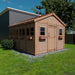 Outdoor Living Today 12×16 Sunshed Garden Shed placed on a green lawn, showcasing multiple side windows and a front doorOutdoor Living Today 12×16 Sunshed Garden Shed placed on a green lawn, showcasing multiple side windows and a front door
