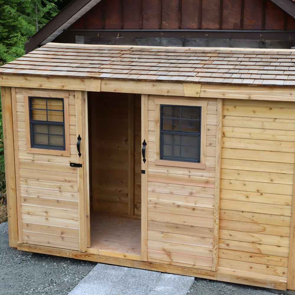 Outdoor Living Today 12×4 with Sliding Doors SpaceSaver Storage Shed is shown with one sliding door open