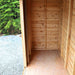 Outdoor Living Today 12×4 with Sliding Doors SpaceSaver Storage Shed shows a clean, empty wooden interior with sunlight spilling in from the open door