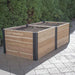 Outdoor Living Today 6×3 Urban Raised Garden Bed is shown freshly filled with soil, ready for planting in a tidy backyard space