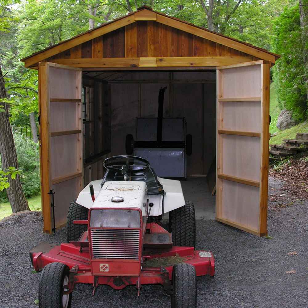 Outdoor Living Today 8×12 Space Master Storage Shed is open with a ride-on lawn mower parked inside