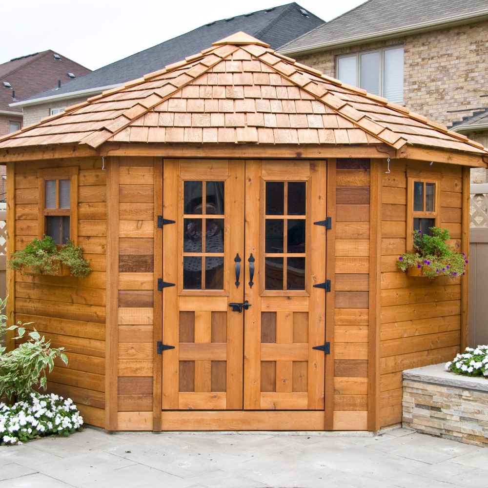 Outdoor Living Today 9×9 Penthouse Garden Shed appears by a patio