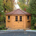 Outdoor Living Today 9×9 Penthouse Garden Shed stands proudly beside a pool, surrounded by autumn trees and garden plants