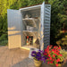 Painted outdoor shed with open doors shows Outdoor Living Today 8ft Western Red Cedar Shed Shelves (Set of 3) neatly holding planters and gardening items beside colorful flowers