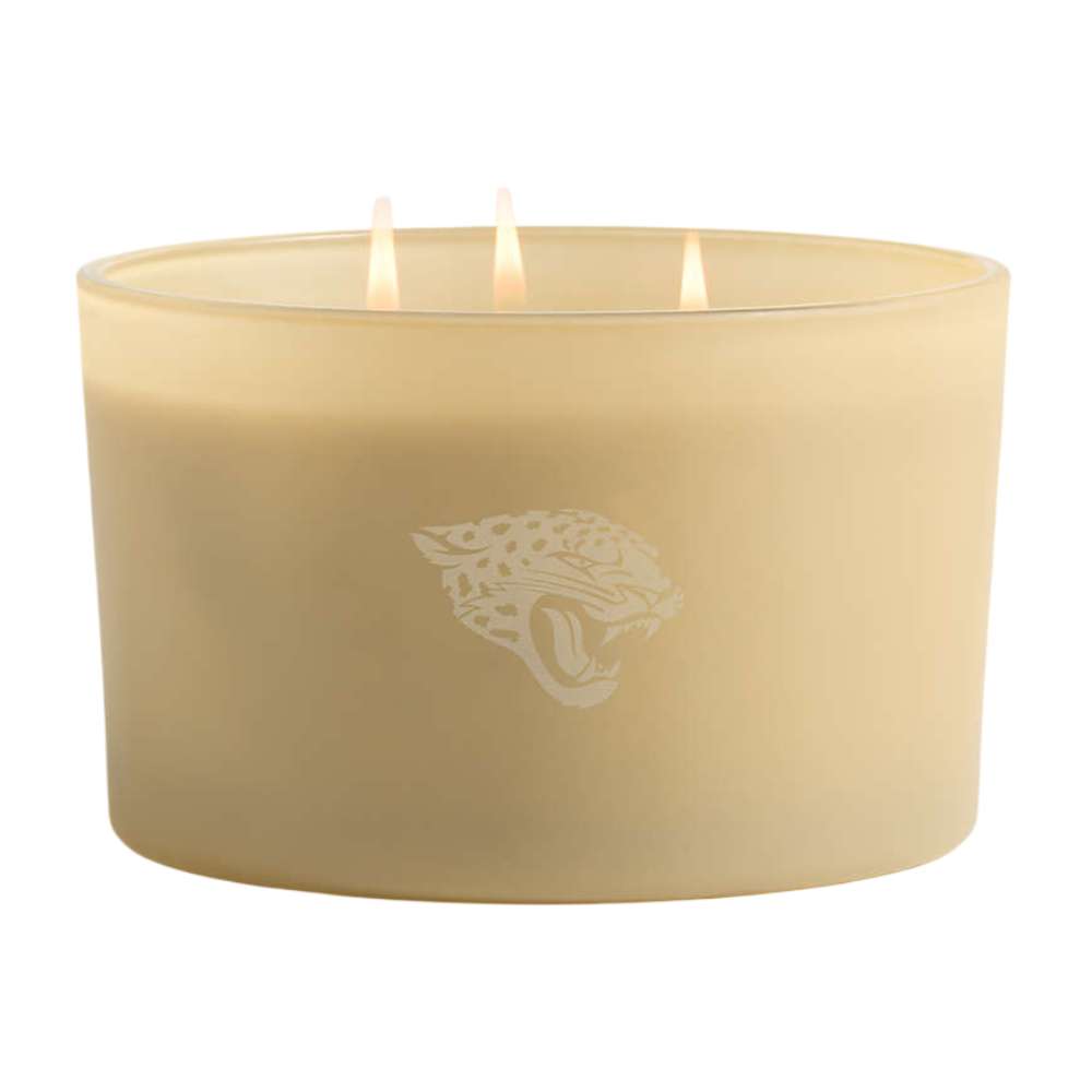 Pampas gold three-wick Crate & Barrel Monochrome Scented Candle featuring a Jacksonville Jaguars logo on the wide glass vessel