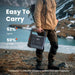 Person carries Jackery Explorer 1500 Ultra Portable Power Station by its built-in handle while hiking through a mountain landscape, showing its portable design