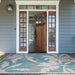 Placed at a front entryway, Couristan Monaco Indoor/Outdoor Rug - Coastal Flora/Ivory-Turquoise adds tropical style to the home