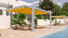 Poolside loungers rest under the bold yellow canopy of a Structureworks Balance Trex Pergola