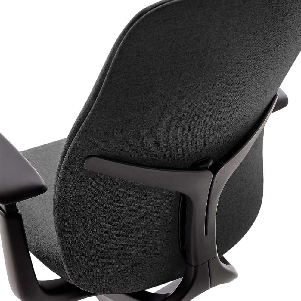 Rear angled view of Crate & Barrel Haworth Zody Upholstered Charcoal Office Chair highlights the upholstered backrest and supportive frame