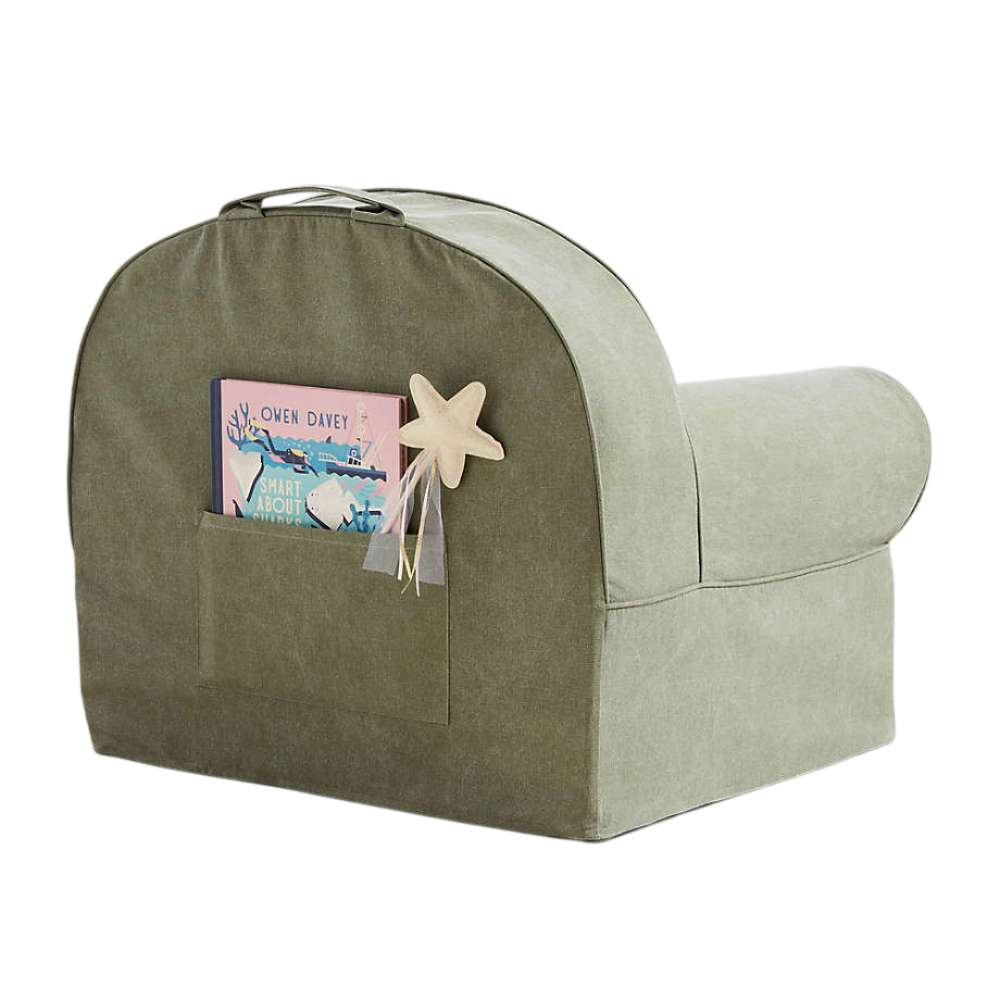 Rear view of Cyprus Green Crate & Barrel Organic Cotton Kids Lounge Nod Chair showing a top carry handle and a storage pocket holding books