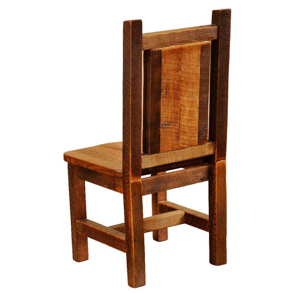 Rear view of Fireside Lodge Barnwood Artisan Dining Side Chair highlighting the thick barnwood posts, solid back panel, and sturdy cross supports