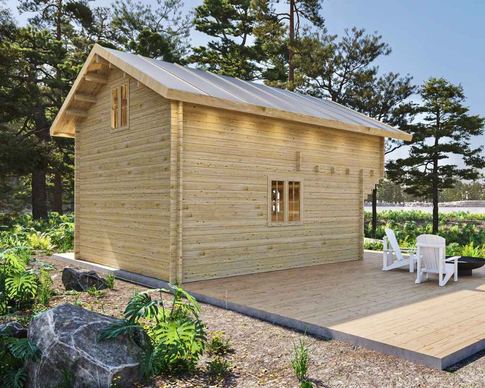 Rear view of Sawmill Structures The Northwood Grand SD 70mm Garden Room shows its sturdy wood paneling, small windows, and spacious deck amid a forest setting