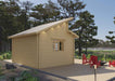 Rear view of the Sawmill Structures The Versa 160 Atrium 70MM Garden Room shows a gabled roof, natural wood walls, and a single window