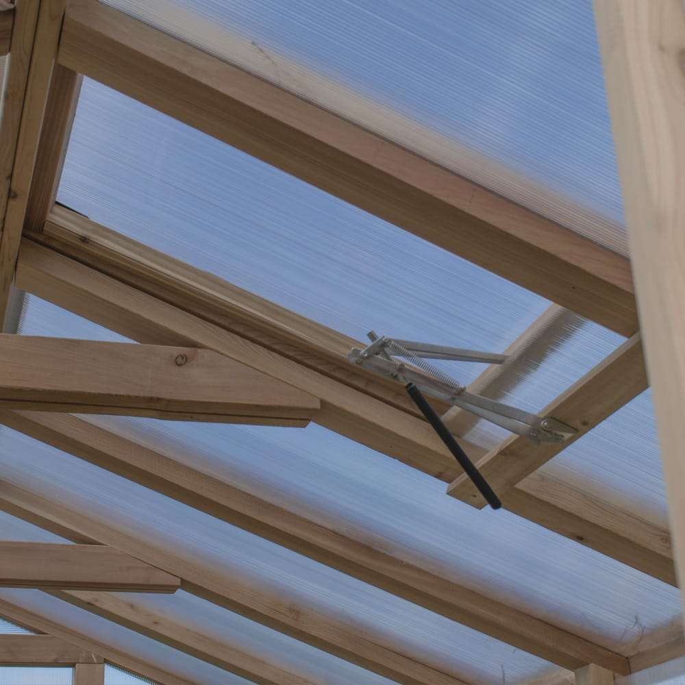 Roof close-up displays strong beams and a vent system in Outdoor Living Today Western Red Cedar Greenhouse Kit for airflow