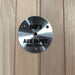 Round stainless MP3 AUX input plate mounted on the wood wall of Golden Designs Dynamic Santiago 2 Person Full Spectrum Infrared Sauna
