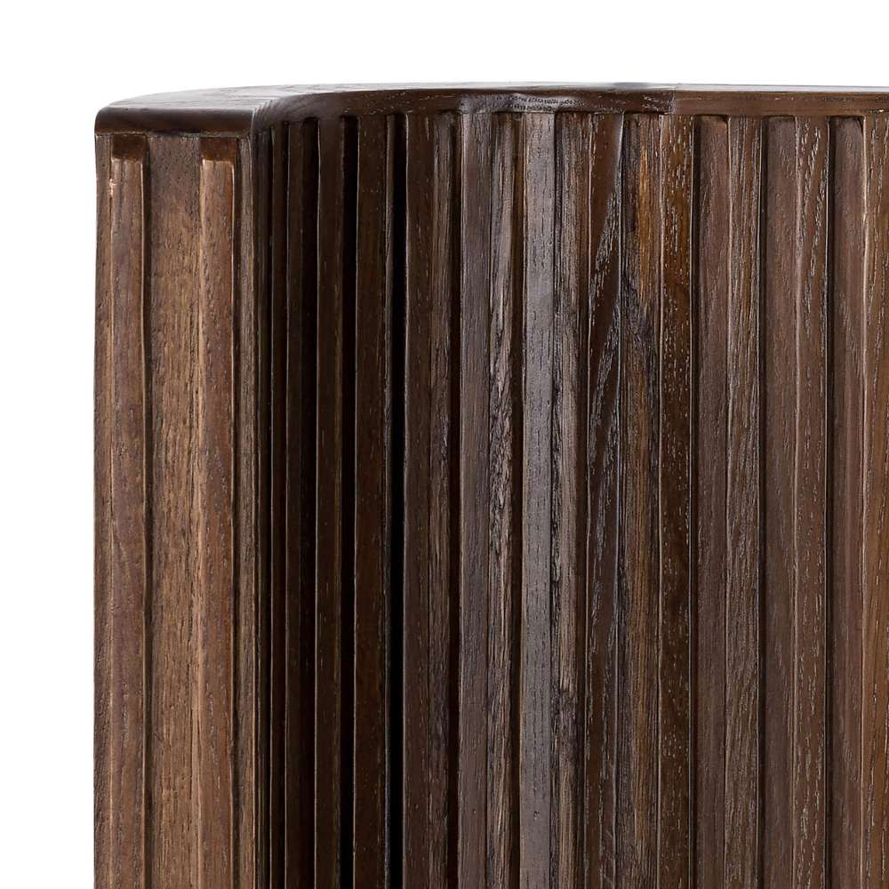 Rounded corner of Crate & Barrel Baylor Brown Ribbed Solid Oak Wood Bed highlights the vertical ribbed oak detailing and smooth craftsmanship