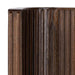 Rounded corner of Crate & Barrel Baylor Brown Ribbed Solid Oak Wood Bed highlights the vertical ribbed oak detailing and smooth craftsmanship