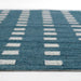 Rows of geometric white square designs stand out on the rich surface of Momeni Archer Indoor Rug - ARC-1 Blue