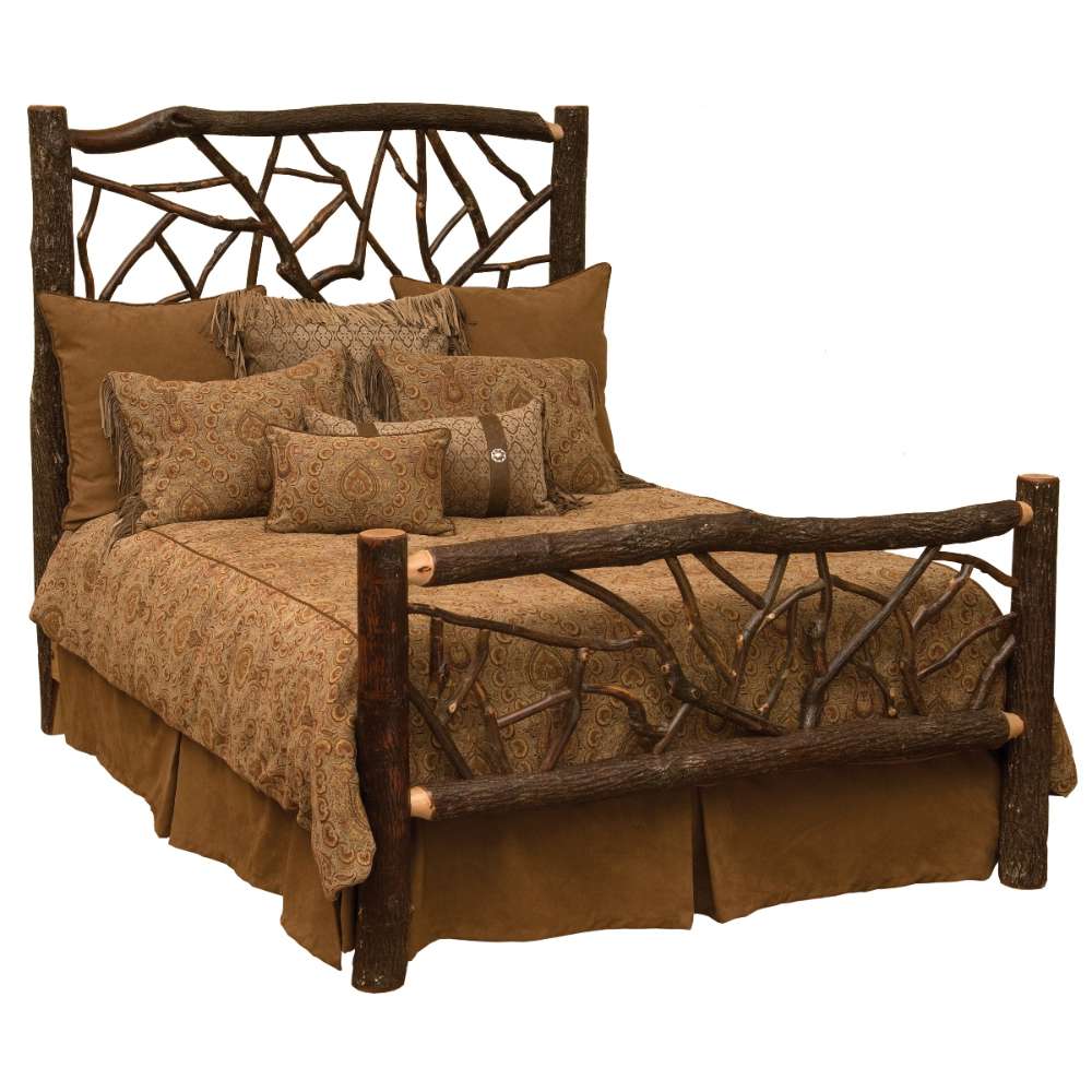 Rustic Fireside Lodge Hickory Log Twig Bed shown as a sturdy log bed with thick wooden posts and twig-style headboard and footboard, dressed in earth-toned bedding