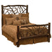 Rustic Fireside Lodge Hickory Log Twig Bed shown as a sturdy log bed with thick wooden posts and twig-style headboard and footboard, dressed in earth-toned bedding