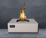 Sand Pebble Warming Trends AON Steel Square Fire Pit Table is lit with bright flames over its brass burner
